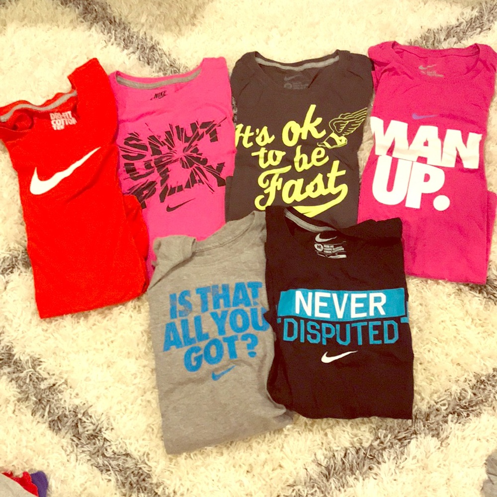 5 medium Nike shirts. Assorted colors